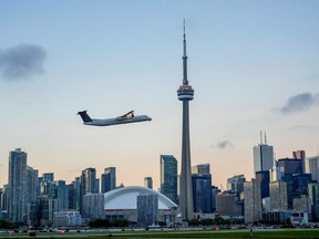 An airplane takes off from Billy Bishop Airport in downtown Toronto on October 6, 2021.