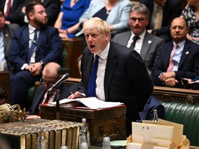 In this photo provided by UK Parliament, Britain's Prime Minister Boris Johnson speaks during Prime Minister's Questions in the House of Commons in London, Wednesday, July 6, 2022. (Jessica Taylor/UK Parliament via AP)