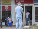 A healthcare worker is shown outside a hospital in Montreal on Thursday, July 14, 2022.