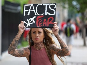 A Freedom Convoy supporter rallies against the Covid-19 vaccine mandate on July 1, 2022 in Ottawa, Canada.