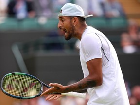 Nick Kyrgios of Australia reacts against Cristian Garin of Chile during their Men's Singles Quarter Final match on day ten of The Championships Wimbledon 2022 at All England Lawn Tennis and Croquet Club on July 06, 2022 in London, England.