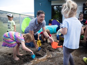 Prime Minister Justin Trudeau plays with children during a visit to a daycare in Lake Country, B.C. on Monday. If you're wondering why the prime minister keeps arbitrarily showing up at daycares, we provide an attempt at an explanation below.