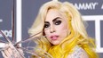 Lady Gaga poses on the red carpet at the 52nd annual Grammy Awards in Los Angeles