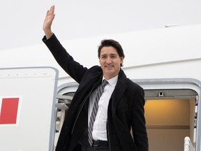 In this November 2021 photo, Prime Minister Justin Trudeau waves before boarding an RCAF VIP transport aircraft to Washington, DC. A little-known fact about these types of photos: Trudeau usually isn't waving at anybody, but he does it anyway because it makes for a good photo.