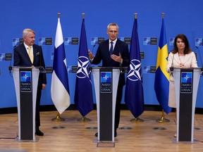 Sweden's Foreign Minister Ann Linde and Finland's Foreign Minister Pekka Haavisto attend a news conference with NATO Secretary General Jens Stoltenberg, after signing their countries' accession protocols at the alliance's headquarters in Brussels, Belgium July 5, 2022. REUTERS/Yves Herman