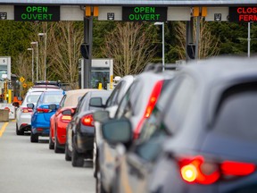 Line-up at the White Rock, B.C. Peace Arch border crossing: Tourism officials warn border measures such as the ArriveCan app risked putting a damper on the 2022 tourism season.