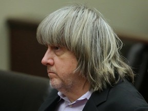 David Turpin appears at his court arraignment with wife Louise in Riverside, California on January 18, 2018. The California couple who held their 13 malnourished children captive in a suburban home were charged Thursday with multiple counts of torture and child abuse as prosecutors said the youngsters had been shackled even to go to the bathroom.
