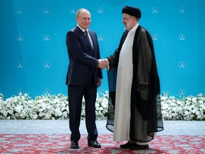 Russian President Vladimir Putin, left, and Iranian President Ebrahim Raisi meet in Tehran on July 19.