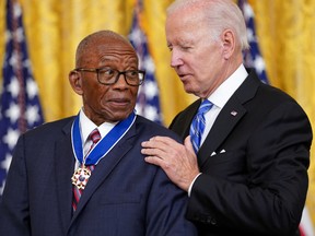 U.S. President Joe Biden, right, presents the Presidential Medal of Freedom to civil rights attorney Fred Gray during a ceremony at the White House in Washington, D.C., on July 7.