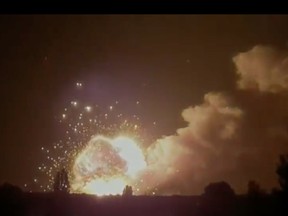 Image taken from social media of a Ukraine-launched HIMARS hitting a Russian ammunition supply depot in Nova Khakovka.