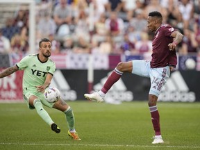 Colorado Rapids midfielder Mark-Anthony Kaye, right, passes the ball as Austin FC forward Maximiliano Urruti defends in the first half of an MLS soccer match Monday, July 4, 2022, in Commerce City, Colo. Toronto FC continues to remake its roster, acquiring Mark-Anthony Kaye from the Colorado Rapids.THE CANADIAN PRESS/AP-David Zalubowski