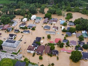 Aerial view of homes submerged under flood waters from the North Fork of the Kentucky River in Jackson, Kentucky, on July 28, 2022.