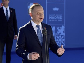 FILE - Poland President Andrzej Duda speaks as he arrives at the NATO Heads of State summit in Madrid, on June 30, 2022. The Polish president says Poland and Israel have taken a step toward normalizing diplomatic ties as the Israeli ambassador officially presented his credentials in Warsaw. President Andrzej Duda tweeted that he and Israeli President Issac Herzog have "agreed that it's time to return to normal relations."