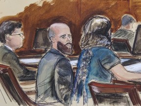 FILE - In this courtroom sketch, Joshua Schulte, center, is seated at the defense table flanked by his attorneys during jury deliberations, Wednesday March 4, 2020, in New York. Schulte, the former CIA software engineer accused of causing the biggest theft of classified information in CIA history, has been convicted at a New York City retrial. A jury reached the guilty verdict against Joshua Schulte on Wednesday, July 13, 2022 in federal court in Manhattan.