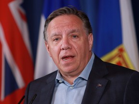 Quebec Premier Francois Legault answers a question during a press conference on the second day of the summer meeting of the Canada's Premiers in Victoria, B.C., on Tuesday, July 12, 2022
