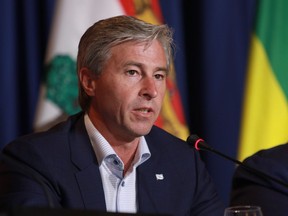 The Nova Scotia government is rolling five economic agencies worth $100 million in spending into two new Crown corporations following a review of its governing bodies. Premier Tim Houston, shown in this Tuesday, July 12, 2022 file photo, says the move is about streamlining operations and making his government more accountable for economic development decisions.