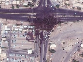 This satellite image provided by Maxar Technologies shows crowds near the Iraq Parliament building in Baghdad Iraq on Saturday, July 30, 2022. Thousands of followers of Muqtada al-Sadr, an influential Shiite cleric, breached Iraq's parliament on Saturday, for the second time this week, protesting government formation efforts lead by his rivals, an alliance of Iran-backed groups. (Satellite image ©2022 Maxar Technologies via AP)