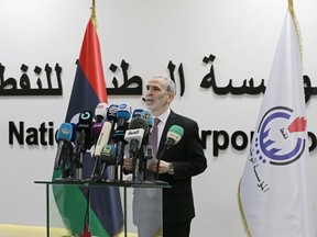 FILE - Chairman of the Libyan National Oil Corporation Mustafa Sanallah holds gives a press conference at the corporation's headquarters in Tripoli, Libya, July 11, 2022. Libya's National Oil Corporation said it resumed oil exports, ending a monthslong hiatus. It said a Malta-flagged tanker, Matala, docked Wednesday, July 20, 2022, at the al-Sidra terminal to ship one million barrels of crude oil. The resumption of oil export has come after one of the country's rival governments fired Sanallah the chairman of the state-run oil corporation