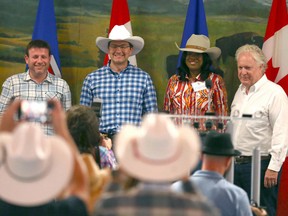 Conservative leadership contestants, from left, Roman Baber, Pierre Poilievre, Leslyn Lewis and Jean Charest in Calgary on July 9, 2022. Scott Aitchison, not pictured, is also a candidate.