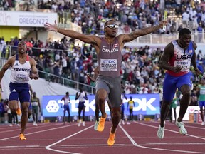 Andre De Grasse, of Canada, wins the final in the men's 4x100-meter relay at the World Athletics Championships on Saturday, July 23, 2022, in Eugene, Ore.