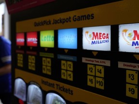 FILE - A lottery ticket vending machine in a convenience store, July 21, 2022, in Northbrook, Ill. The next Mega Millions drawing is Tuesday, July 25.