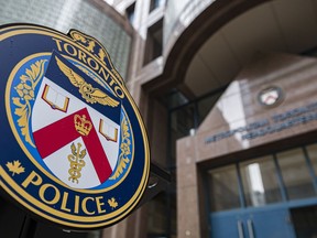 The Toronto Police Services emblem is photographed during a press conference at TPS headquarters, in Toronto on Tuesday, May 17, 2022. Toronto police are offering two rewards of up to $50,000 each in an effort to arrest two men wanted in separate murder investigations.