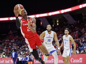 Canada's Shai Gilgeous-Alexander (2) drives to the net during first half FIBA international men's World Cup basketball qualifying action against Dominican Republic, in Hamilton, Ont., Friday, July 1, 2022. In his first national team appearance in six years, and first game in his hometown since high school, Gilgeous-Alexander, an Oklahoma City Thunder guard, scored 15 of his 32 points in a dominant third quarter, leading Canada to a 95-75 victory over the Dominican Republic in World Cup qualifying.