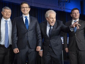 Candidates Scott Aitchison, left,  Pierre Poilievre, Jean Charest    and Roman Baber, pose for photos after the French-language Conservative Leadership debate Wednesday, May 25.