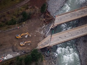 Collapsed sections of bridges destroyed by severe flooding and landslides on the Coquihalla Highway north of Hope, B.C., are seen in an aerial view from a Canadian Forces reconnaissance flight on November 22, 2021. Canada's emergency preparedness minister Bill Blair says Ottawa is providing $870 million, with more to come, to support recovery efforts after destructive flooding in British Columbia last fall.