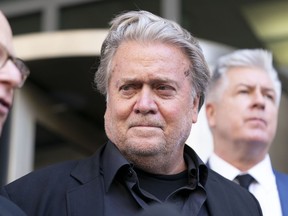 Former White House strategist Steve Bannon, accompanied by his attorneys David Schoen, left and M. Evan Corcoran, right, speaks with the media departs federal court, Friday, July 22, 2022, in Washington. Bannon, a longtime ally of former President Donald Trump has been convicted of contempt charges for defying a congressional subpoena from the House committee investigating the Jan. 6 insurrection at the U.S. Capitol.