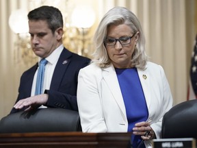 Rep. Adam Kinzinger, R-Ill., left, and Vice Chair Liz Cheney, R-Wyo., arrive as the House select committee investigating the Jan. 6 attack on the U.S. Capitol holds a hearing at the Capitol in Washington, Thursday, July 21, 2022.