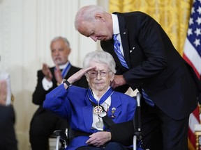 President Joe Biden awards the nation's highest civilian honor, the Presidential Medal of Freedom, to Wilma Vaught during a ceremony in the East Room of the White House in Washington, Thursday, July 7, 2022. Vaught, a retired brigadier general and one of the most decorated women in U.S. military history, broke gender barriers on her rise through the ranks of the Air Force.