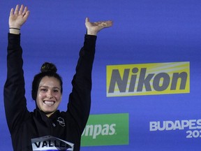 Second placed Mia Vallee of Canada celebrates after the women's diving 3m springboard final at the 19th FINA World Championships in Budapest, Hungary, Saturday, July 2, 2022. The 21-year-old from Beaconsfield, Que., grabbed her second podium -- and the country's third at the event in diving -- with a silver in the women's three-metre springboard.
