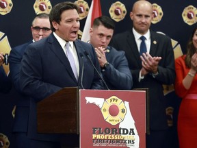 Florida Gov. Ron DeSantis speaks to the applause of firefighters as he accepts the endorsement of the Florida Professional Firefighters during a gathering at the Hilton Orlando in Orlando, Fla., on Tuesday, July 12, 2022. DeSantis received the endorsement despite the fact that he dissolved the Disney Community Development District, which funded the Reedy Creek Fire District, earlier in the year.