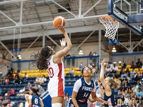 Canada's Yvonne Ejim (10) goes for the basket during Globl Jam women's international U23 basketball action against France, in Toronto in a Sunday, June 10, 2022, handout photo.