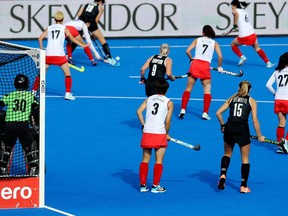 Canada's Audrey Sawers (19) and teammates Madison Thompson (9) and Grace Delmotte (15) are shown in action in a 3-2 loss to South Korea at the women's field hockey World Cup, in Barcelona, Spain, in a Sunday, July 3, 2022, handout photo.