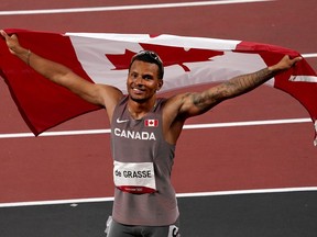 Canada's Andre De Grasse reacts after his bronze medal finish in the men's 100m final event during the Tokyo Summer Olympic Games, in Tokyo on August 1, 2021.