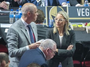 Vancouver Canucks assistant general manager Emilie Castonguay talks to GM Patrik Allvin during the first round of the NHL draft in Montreal, Thursday, July 7, 2022.