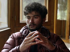 FILE - Pakistani mountain climber Shehroz Kashif, 19, gives an interview to The Associated Press, in Skardu, a town in the Gilgit Baltistan region of northern Pakistan, Sunday, Aug. 1, 2021. Kashif, who became the youngest climber of one of the world's highest mountains is safe after going missing during his latest expedition to another peak, an official said Thursday, July 7, 2022.