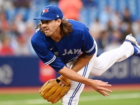 Toronto Blue Jays' starting pitcher Kevin Gausman throws to a Boston Red Sox batter in first inning American League baseball action in Toronto on Monday June 27, 2022.&nbsp;Gausman was helped off the field in the Toronto Blue Jays first game of a doubleheader against the Tampa Bay Rays.