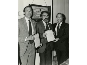 Irving Abella, centre, and Harold Troper accept the Toronto Jewish Cultural Council Writer's Award for None is Too Many, with Meyer Feldman, right, in this May 27, 1985 handout photo. Abella, co-author of "None is too Many," which detailed Canada's refusal to accept Jewish refugees fleeing the Holocaust, has died at age 82.