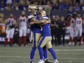Winnipeg Blue Bombers kicker Marc Liegghio (13), right, celebrates his game winning field goal with quarterback Dakota Prukop (12) against the Ottawa Redblacks during the second half of CFL action in Winnipeg, Friday, June 10, 2022. The Bombers have rolled out a 4-0 record to start the CFL season, and Liegghio has made all 10 of his field-goal attempts. He's also pulling triple duty and has been solid in punting and kickoffs.