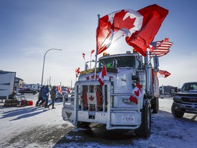 The last truck blocking the southbound lane moves after a breakthrough to resolve the impasse at the protest blockade at the United States border at Coutts, Alta., Wednesday, Feb. 2, 2022.