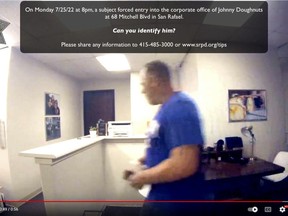 This Monday, July 25, 2022, image taken from a surveillance video posted on YouTube and provided by the San Rafael Police Department shows a subject who forced entry into the corporate office of Johnny Doughnuts in San Rafael. The burglar had to double back to the scene of the crime, the corporate office of a the San Francisco Bay Area doughnut company – this week because he forgot his keys. Police are asking for the public's help in identification. (San Rafael Police Department via AP)