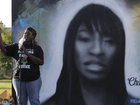 FILE - Tonya Isabell, left, speaks on June 18, 2020, during a vigil for her cousin Charleena Lyles, pictured at right, on the third anniversary of her death, in Seattle. An inquest jury found Wednesday, July 6, 2022, that two Seattle police officers were justified in fatally shooting Lyles, a mentally unstable, pregnant, Black mother of four children, inside her apartment when she menaced them with knives in 2017.