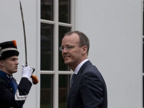 FILE - Dutch Central Bank President Klaas Knot, right, arrives at the Prime Minister's residence for a meeting with European Central Bank President Mario Draghi in The Hague, Netherlands, Monday April 15, 2013. Knot apologized Friday, July 1, 2022 for the institution's involvement in the 19th-century slave trade, the latest apology in the Netherlands linked to the country's historic role in the trade in enslaved people.