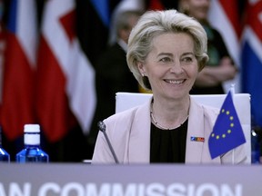 FILE - European Commission President Ursula von der Leyen waits for the start of a round table meeting at a NATO summit in Madrid, Spain on Wednesday, June 29, 2022. The EU's executive arm pledged an emergency plan this month to help member countries do without Russian energy amid the Kremlin's war in Ukraine. Von der Leyen said on Friday, July 1, 2022 the initiative would build on EU moves to ditch Russian coal, oil and natural gas and would complement a bloc-wide push to accelerate the development of renewable energy such as wind and solar power.