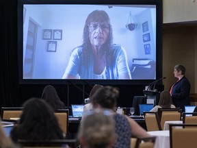Brenda Forbes, a former neighbour of Gabriel Wortman in Portapique, N.S., is questioned by commission counsel Emily Hill, right, at the Mass Casualty Commission inquiry into the mass murders in rural Nova Scotia on April 18/19, 2020, in Halifax on Tuesday, July 12, 2022. Wortman, dressed as an RCMP officer and driving a replica police cruiser, murdered 22 people.