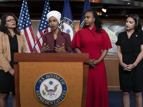 FILE - U.S. Rep. Ilhan Omar, D-Minn speaks, as U.S. Reps., from left, Rashida Tlaib, D-Mich., Ayanna Pressley, D-Mass., and Alexandria Ocasio-Cortez, D-N.Y., listen, during a news conference at the Capitol in Washington, July 15, 2019. A federal judge sentenced David George Hannon to three years of probation and a $7,000 fine for sending an email threatening to kill Omar and the three other congresswomen after the news conference.