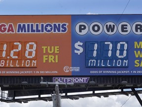 A sign displays the Mega Millions lottery jackpot in Detroit, Friday, July 29, 2022. The Mega Millions lottery jackpot keeps getting larger as officials raised the massive prize to $1.28 billion on Friday, just hours before the next drawing.